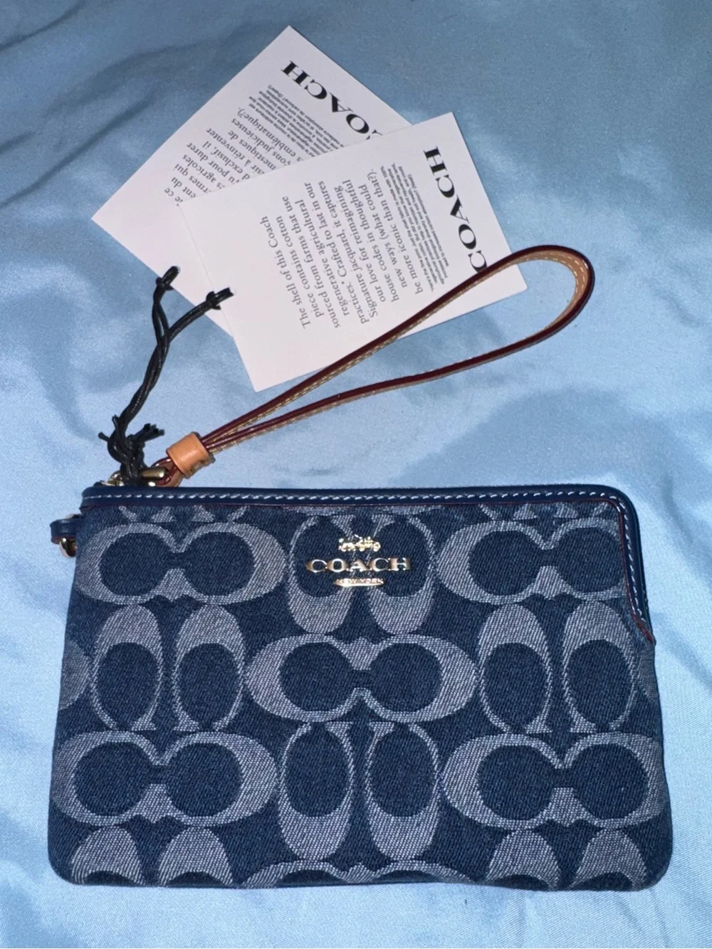 Coach Signature Denim Wristlet in Navy with Brown Leather Strap and cherry charm